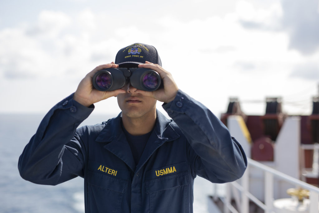 Midshipman looking through binoculars